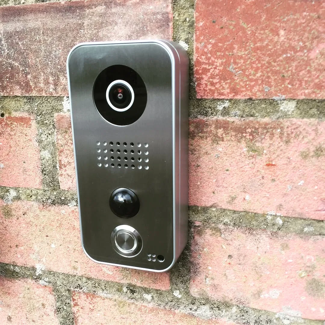 Doorbird video-entry unit fitted to a brick wall